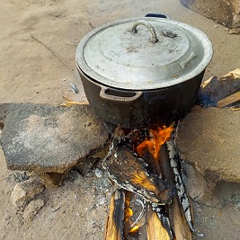 three-stone open-fire cooking practice in Liberia