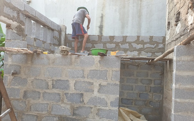 men building new house