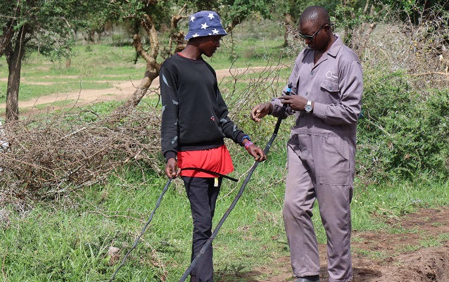 Bernard Omondi, Sunculture, taking Emmanuel Koobai, Olkiloriti Group through the installation of end caps of drips lines
